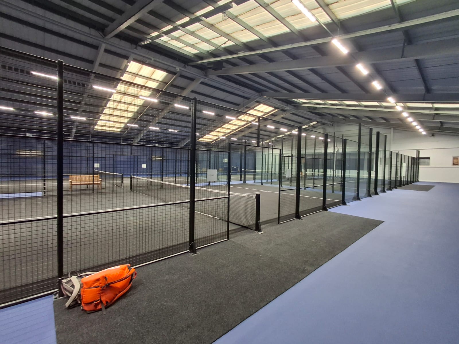 New LED high-bay lighting above the indoor padel courts at David Lloyd Manchester North
