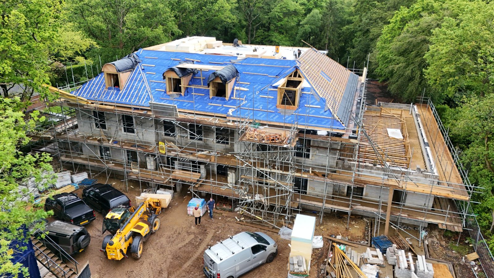 Drone view of Woodrising luxury home during roofing works